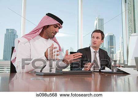 Western and middle eastern businessmen in meeting View Large Photo Image Stock Photo - Western and middle eastern businessmen in meeting. Fotosearch