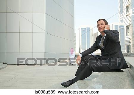 Western businessman on cellphone in dubai View Large Photo Image Stock Photo - Western businessman on cellphone in dubai. Fotosearch