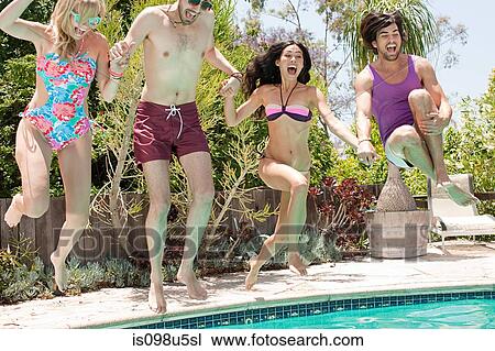 Young friends in swimming pool on vacation View Large Photo Image Stock Image - Young friends in swimming pool on vacation. Fotosearch