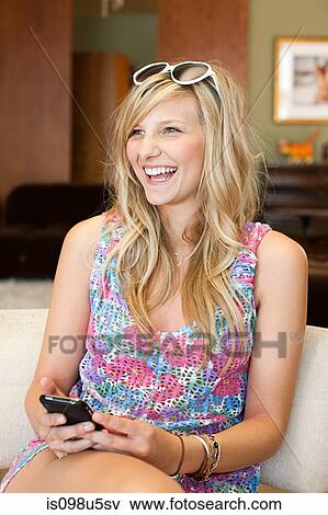 Stock Photo - Young woman with blond hair. Fotosearch