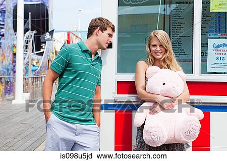 Teenage couple at pier with teddy bear View Large Photo Image Stock Image - Teenage couple at pier with teddy bear. Fotosearch