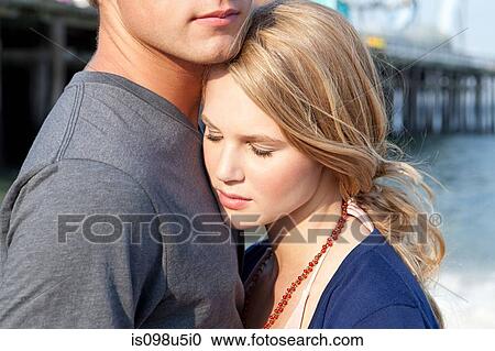 Teenage couple hugging View Large Photo Image Stock Image - Teenage couple hugging. Fotosearch