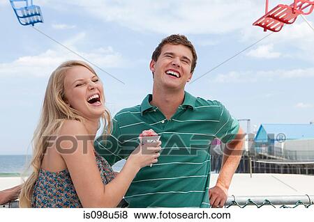 Teenage couple laughing View Large Photo Image Stock Photo - Teenage couple laughing. Fotosearch