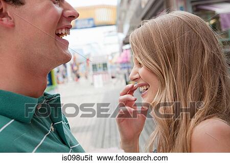 Teenage couple laughing View Large Photo Image Stock Photograph - Teenage couple laughing. Fotosearch