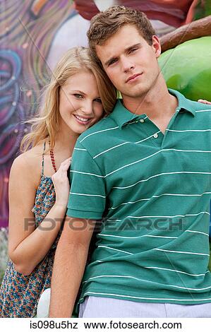 Stock Photo - Teenage couple looking at camera. Fotosearch