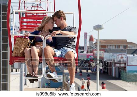 Teenage couple on ferris wheel View Large Photo Image Stock Image - Teenage couple on ferris wheel. Fotosearch