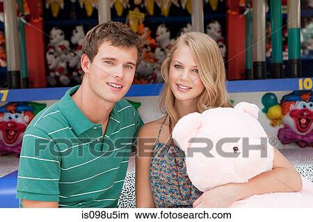 Picture - Teenage couple with teddy bear. Fotosearch