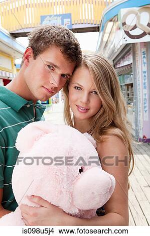 Teenage couple with teddy bear View Large Photo Image Picture - Teenage couple with teddy bear. Fotosearch