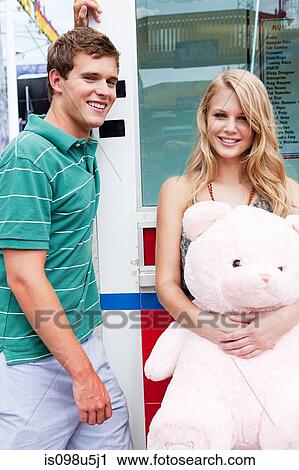 Teenage couple with teddy bear View Large Photo Image Stock Image - Teenage couple with teddy bear. Fotosearch