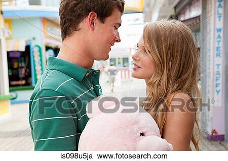 Teenage couple with teddy bear View Large Photo Image Stock Image - Teenage couple with teddy bear. Fotosearch