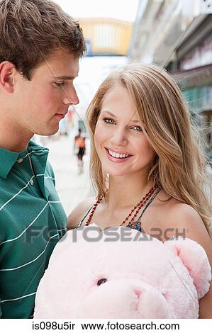 Teenage couple with teddy bear View Large Photo Image Stock Photography - Teenage couple with teddy bear. Fotosearch
