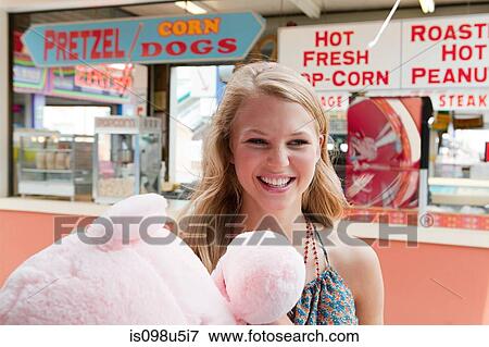 Teenage girl at fun fair with teddy bear View Large Photo Image Stock Photo - Teenage girl at fun fair with teddy bear. Fotosearch