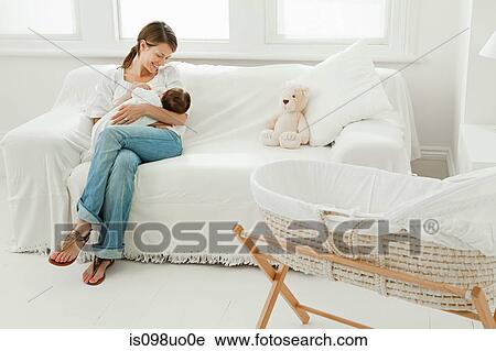 Mother and baby on sofa View Large Photo Image Stock Image - Mother and baby on sofa. Fotosearch