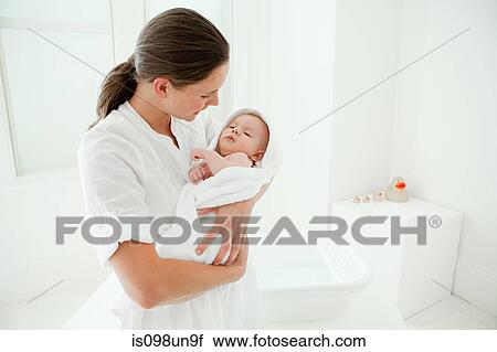 Mother and baby son wrapped in towel View Large Photo Image Stock Image - Mother and baby son wrapped in towel. Fotosearch