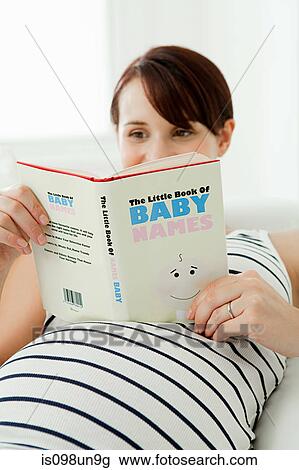 Pregnant woman with baby name book View Large Photo Image Stock Image - Pregnant woman with baby name book. Fotosearch