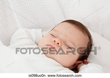 Picture - Sleeping baby girl. Fotosearch