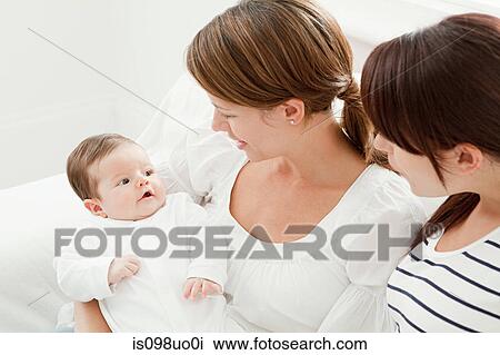 Two women with baby girl View Large Photo Image Stock Image - Two women with baby girl. Fotosearch
