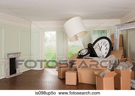 Cardboard boxes of objects in tiny room View Large Photo Image Picture - Cardboard boxes of objects in tiny room. Fotosearch