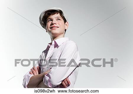 Stock Image - Boy looking up and smiling. Fotosearch