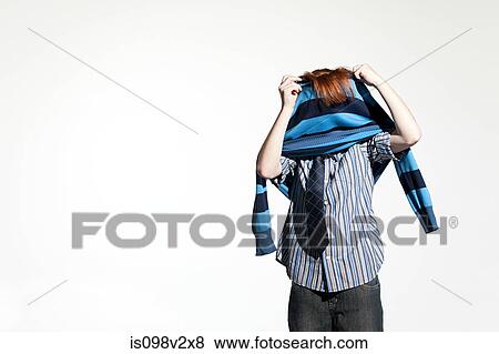 Stock Photo - Boy taking off his sweater. Fotosearch