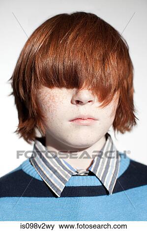 Boy with hair covering his eyes View Large Photo Image Stock Photo - Boy with hair covering his eyes. Fotosearch