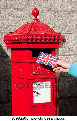Person putting postcard in post box, London View Large Photo Image Stock Image - Person putting postcard in post box, London. Fotosearch