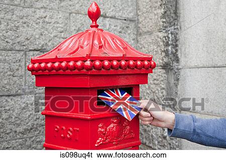 Person putting postcard in post box, London View Large Photo Image Stock Photograph - Person putting postcard in post box, London. Fotosearch
