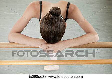 Ballerina resting on barre View Large Photo Image Stock Image - Ballerina resting on barre. Fotosearch