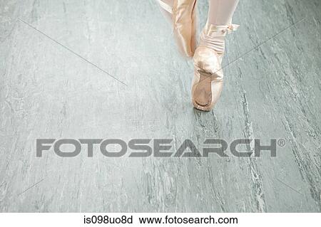 Stock Image - Feet of ballerina en pointe. Fotosearch