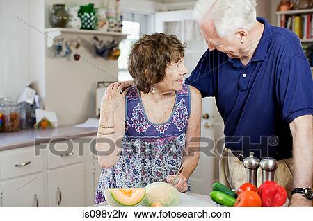 Stock Photo - Senior couple in kitchen. Fotosearch