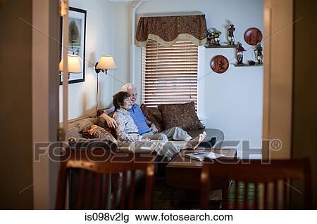 Senior couple watching tv at home View Large Photo Image Stock Image - Senior couple watching tv at home. Fotosearch