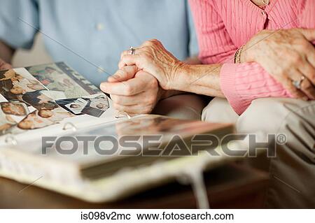 Senior couple with at family album View Large Photo Image Stock Image - Senior couple with at family album. Fotosearch