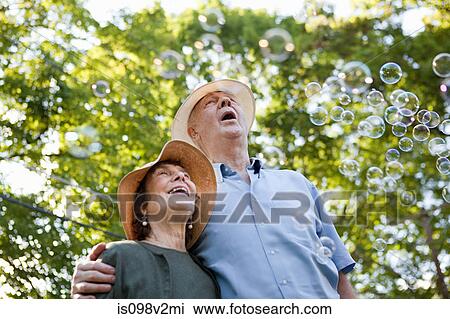 Senior couple with bubbles View Large Photo Image Stock Image - Senior couple with bubbles. Fotosearch