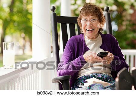 Senior woman using cellphone View Large Photo Image Stock Image - Senior woman using cellphone. Fotosearch