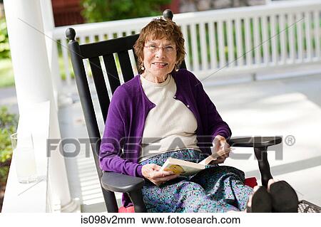 Senior woman with book View Large Photo Image Picture - Senior woman with book. Fotosearch
