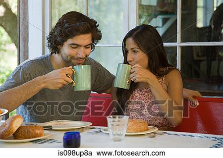 Stock Image - Couple having coffee. Fotosearch