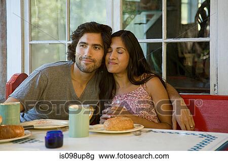 Couple relaxing at breakfast View Large Photo Image Stock Image - Couple relaxing at breakfast. Fotosearch