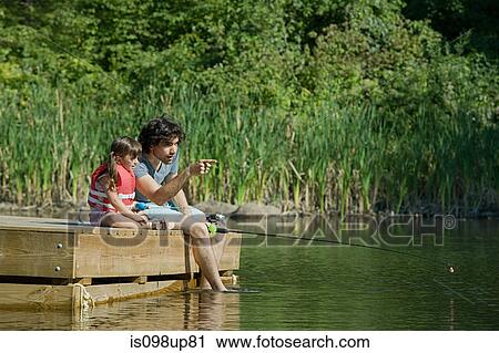 Father and daughter fishing from jetty View Large Photo Image Stock Image - Father and daughter fishing from jetty. Fotosearch
