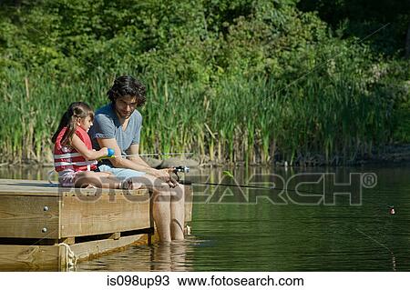 Father and daughter fishing from jetty View Large Photo Image Stock Image - Father and daughter fishing from jetty. Fotosearch