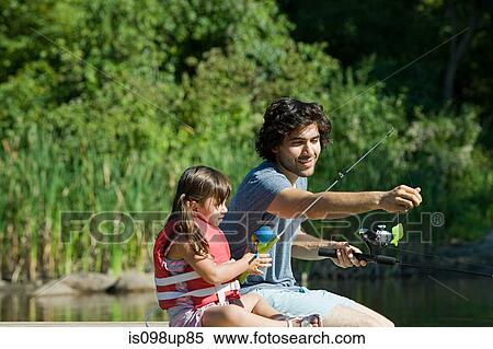 Stock Photography - Father and daughter fishing. Fotosearch