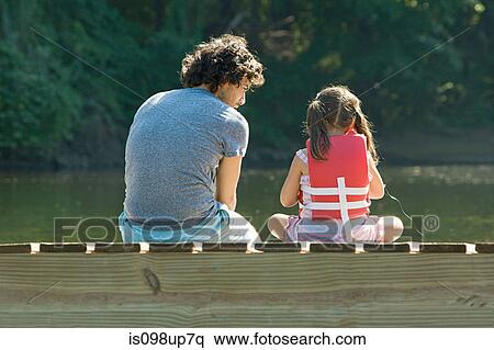 Father and daughter on jetty in lake View Large Photo Image Stock Photography - Father and daughter on jetty in lake. Fotosearch