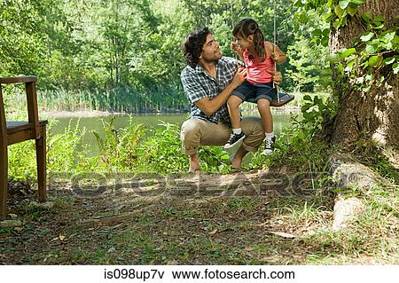 Father and daughter on swing View Large Photo Image Stock Photo - Father and daughter on swing. Fotosearch