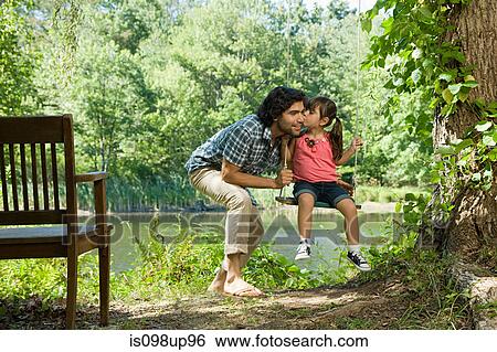 Father and daughter on swing View Large Photo Image Stock Photograph - Father and daughter on swing. Fotosearch