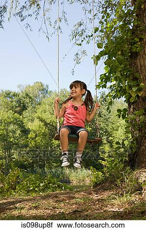 Stock Image - Girl on a swing. Fotosearch