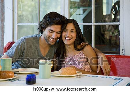 Stock Photo - Happy couple at breakfast. Fotosearch