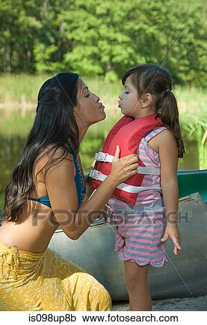 Mother and daughter making kissing faces View Large Photo Image Stock Image - Mother and daughter making kissing faces. Fotosearch