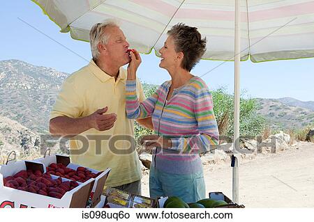 Mature couple at rural fruit stand View Large Photo Image Picture - Mature couple at rural fruit stand. Fotosearch