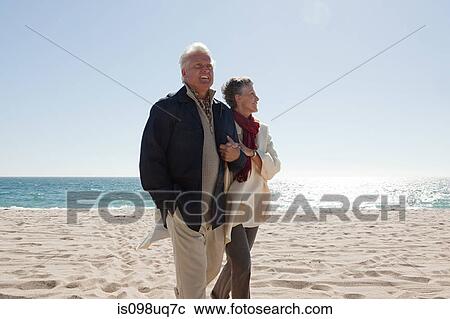 Stock Image - Mature couple by the sea. Fotosearch