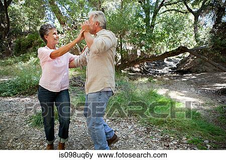 Mature couple dancing in forest View Large Photo Image Stock Photo - Mature couple dancing in forest. Fotosearch