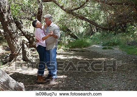 Stock Photograph - Mature couple dancing in forest. Fotosearch
